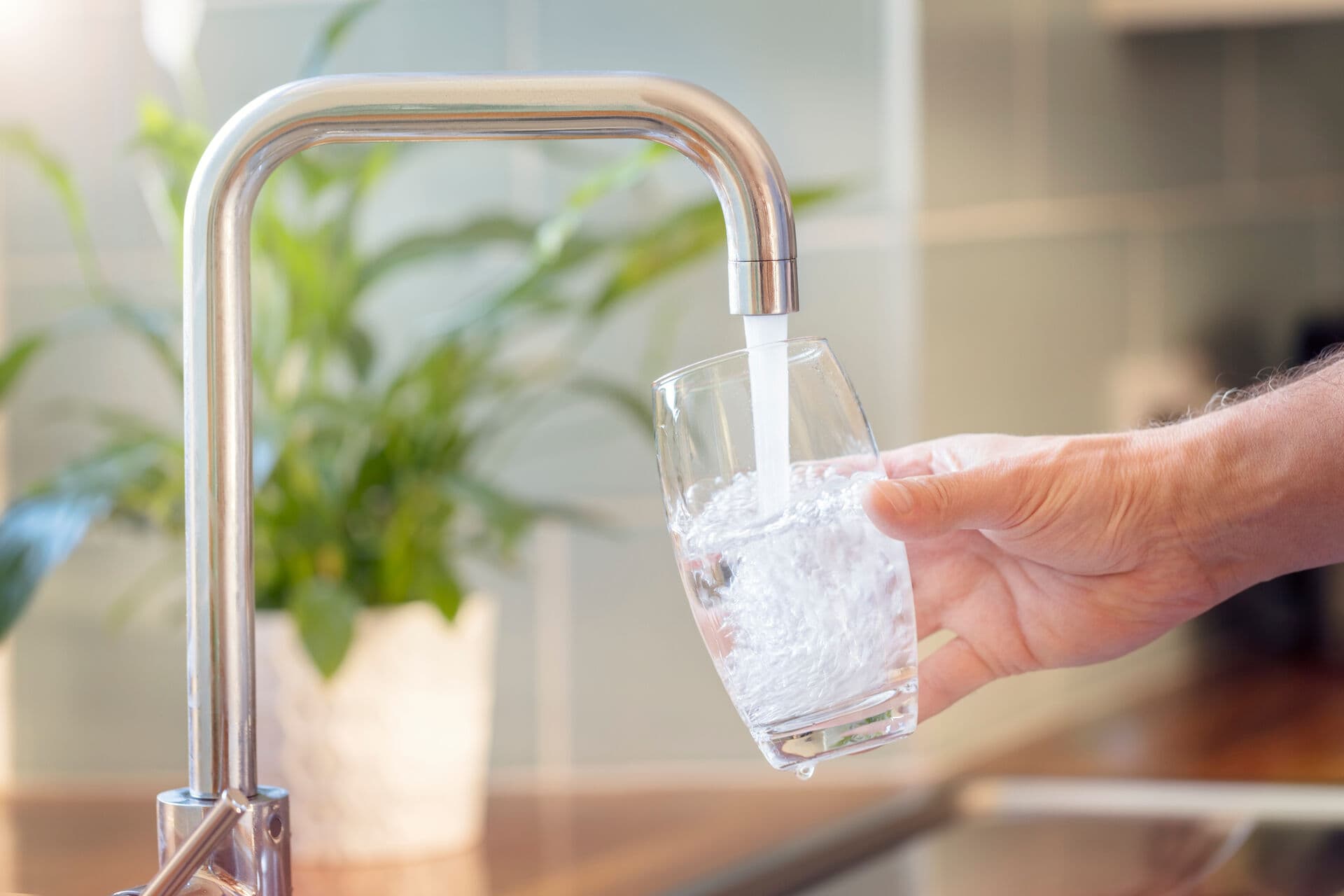 Pure filtered water filling a glass