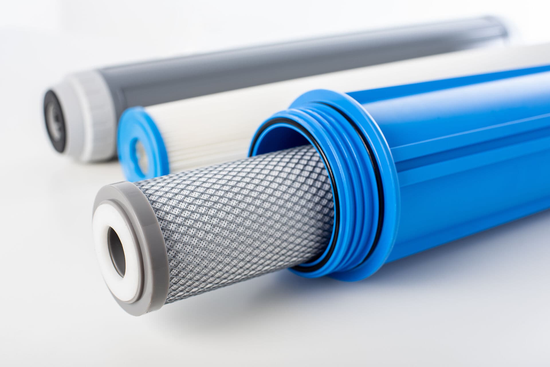 Water filtration cartridges and filter components