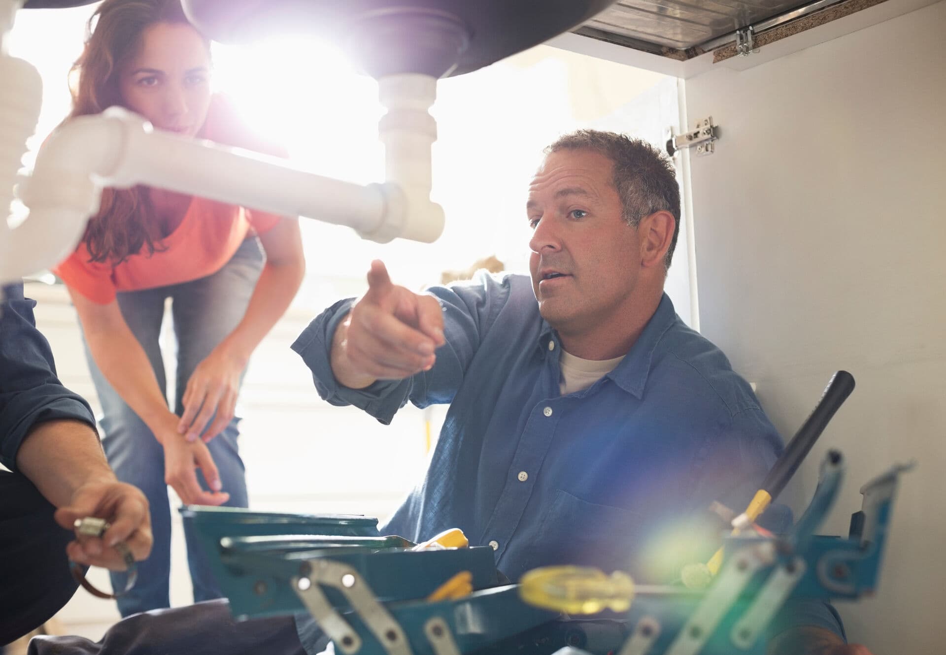 HydraGen technician installing an under-sink water filtration system