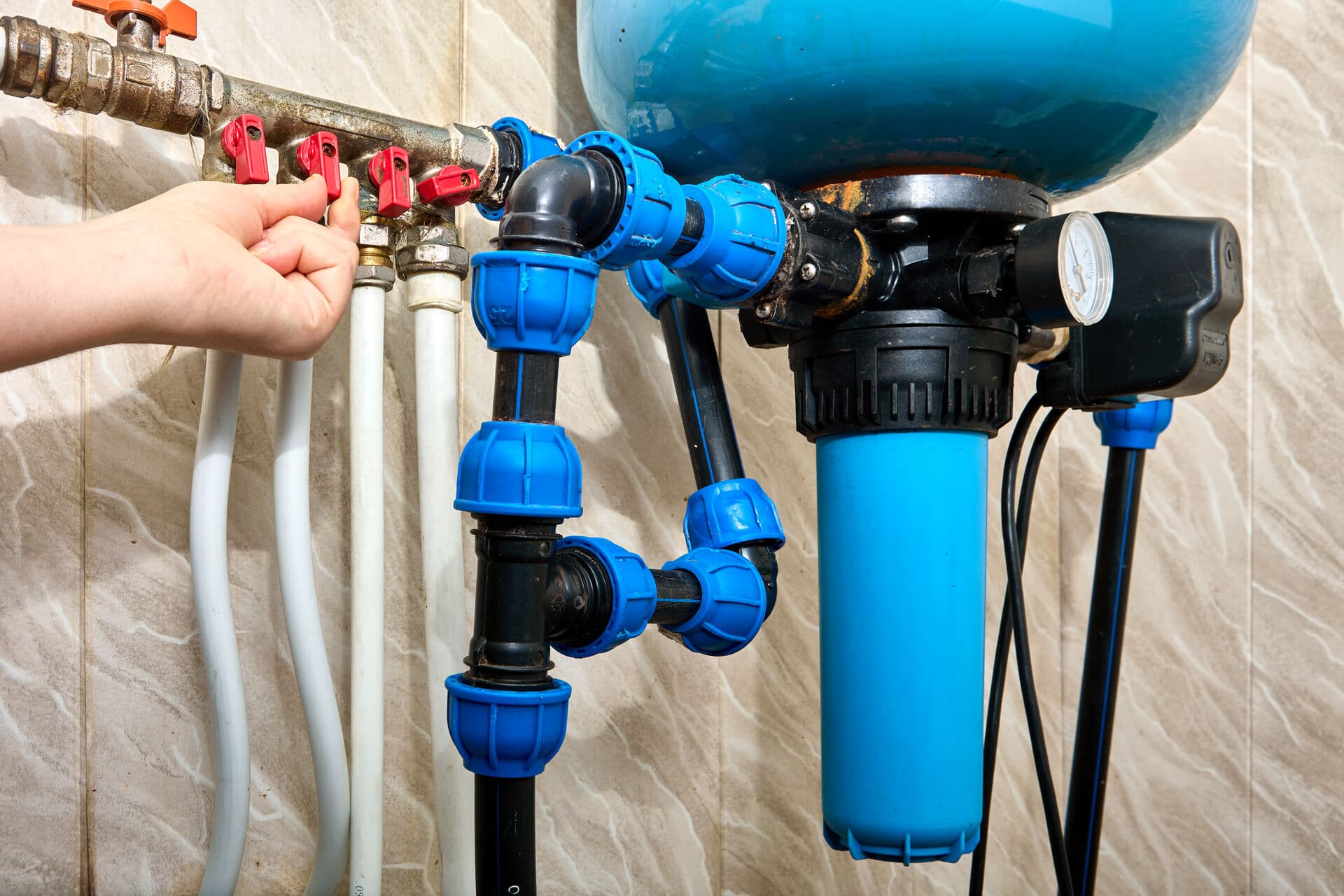 Well water pump system with blue pipe fittings